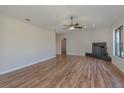 Spacious living room featuring hardwood floors, a modern fireplace, and plenty of natural light at 1842 Evergreen Dr, Edgewater, FL 32141
