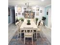Traditional dining room with light fixture, wainscoting, and neutral-colored walls at 2630 S Tanner Rd, Orlando, FL 32820