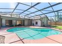 Enjoy a screened-in pool area complete with in-ground pool, in-ground spa, and plenty of space to relax and enjoy the sun at 3150 Rider Pl, Orlando, FL 32817