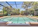 Inviting screened-in pool area with turquoise water, a raised spa, and comfortable seating for relaxation at 424 Curry Ct, Altamonte Springs, FL 32714