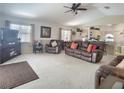 Spacious living room featuring plush furnishings, bright natural light, and an open floor plan at 517 Westwind Dr, Davenport, FL 33896