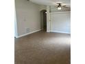 Spacious living room with neutral walls, tile flooring and a ceiling fan at 581 Farmingham Ct, Oviedo, FL 32765