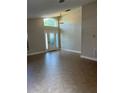 Bright and airy living room with high ceilings, tile flooring and a large window at 581 Farmingham Ct, Oviedo, FL 32765