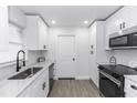Bright kitchen featuring stainless steel appliances, granite countertops, and modern fixtures at 657 Lear Ter, Deltona, FL 32725