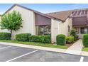 Exterior view of P-6 unit showcasing its neatly manicured landscaping and convenient parking at 101 Grand Plaza Dr # P6, Orange City, FL 32763