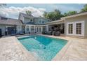 Inviting backyard pool area with a patio and outdoor seating, perfect for relaxing and entertaining at 104 Forest Point Ln, Longwood, FL 32779