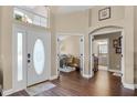 Elegant foyer with hardwood floors and views of the office and bathroom at 14377 Lord Barclay Dr, Orlando, FL 32837
