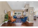 Cozy living room with fireplace, hardwood floors, and ample natural light at 14377 Lord Barclay Dr, Orlando, FL 32837