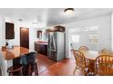 Open kitchen with stainless steel appliances and a center island with barstool seating at 1805 Paloma Ave, Sanford, FL 32771