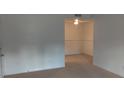 Neutral living room with a carpeted floor and white walls at 315 Wymore Rd # 104, Altamonte Springs, FL 32714
