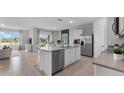 Spacious kitchen with stainless steel appliances and a center island at 3346 Wakefield Dr, Haines City, FL 33844