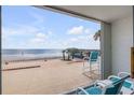 Balcony view showing the beach, the pier, and outdoor seating at 3641 S Atlantic Ave # 110, Daytona Beach, FL 32118
