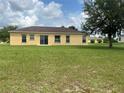 Spacious backyard showcasing a well-maintained lawn, perfect for gatherings and enjoying the outdoors at 3651 Sail Harbor Dr, Kissimmee, FL 34746