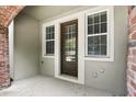 This inviting entrance features sidelight windows and a brick archway, enhancing its charm at 439 Windmill Palm Cir, Altamonte Springs, FL 32701