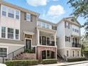 Charming townhome with inviting porch and well-maintained landscaping for great curb appeal at 439 Windmill Palm Cir, Altamonte Springs, FL 32701