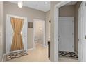 Bright entryway features tile floors, and access to a half-bath at 479 Harbor Winds Ct, Winter Springs, FL 32708