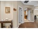 Hallway with hardwood flooring leads to kitchen and living areas at 479 Harbor Winds Ct, Winter Springs, FL 32708