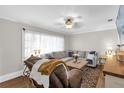 Relaxing living room area with a plush sectional sofa and warm, inviting ambiance at 512 Dixson St, Orange City, FL 32763
