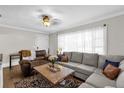 Bright living room with an oversized sectional sofa, patterned rug, and decorative lamps at 512 Dixson St, Orange City, FL 32763