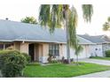 Charming single-story home with a well-manicured lawn and a grand palm tree in the front yard at 596 Starstone Dr, Lake Mary, FL 32746