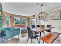 Bright dining room featuring modern table and seating plus lovely view of outdoors at 6337 Parc Corniche Dr # 2312, Orlando, FL 32821