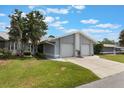 Inviting single-story home with a manicured lawn, two-car garage and a welcoming entrance at 10438 Sw 85Th Ct, Ocala, FL 34481