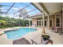 Relaxing screened-in pool area with outdoor seating and lush landscaping at 1453 Langham Ter, Lake Mary, FL 32746