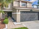 Home featuring a well-manicured lawn, easy access walkway and a two-car garage at 1803 Meadow Pond Way, Orlando, FL 32824