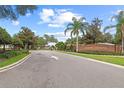 Entrance to Baker's Crossing features a well-maintained brick sign and manicured landscaping at 298 Clydesdale Cir, Sanford, FL 32773