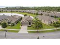 An aerial front view of the lovely home, showcasing its well-maintained lawn and appealing design at 3349 Sagebrush St, Harmony, FL 34773