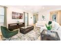 Bright living room features modern decor, comfortable seating, and a wall-mounted TV at 408 Southfield St, Kissimmee, FL 34747