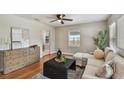 Cozy living room features hardwood floors, neutral paint, and a large sectional sofa at 536 W King St, Orlando, FL 32804