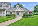 Beautiful single-story home features a pristine lawn and charming architectural details at 104 Nautica Mile Dr, Clermont, FL 34711