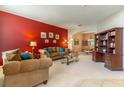 Spacious living room showcasing a large sofa, and open layout for entertaining and relaxation at 1933 Darlin Cir, Orlando, FL 32820