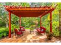 Inviting outdoor patio under pergola featuring comfortable seating, perfect for entertaining or relaxing at 1933 Darlin Cir, Orlando, FL 32820