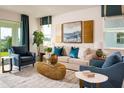Comfortable living room showcasing stylish furniture, modern art, and serene color palette at 2500 Raghav Trail Cir, Tavares, FL 32778