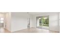 Bright living room with sliding glass doors leading to an outdoor space at 2500 Raghav Trail Cir, Tavares, FL 32778