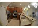Well-equipped kitchen featuring stainless steel appliances and granite countertops at 3308 Rodrick Cir, Orlando, FL 32824