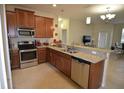 Well-equipped kitchen featuring stainless steel appliances and granite countertops at 3308 Rodrick Cir, Orlando, FL 32824