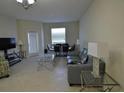 Spacious living room with dining area that offers modern furnishings and neutral tones at 3308 Rodrick Cir, Orlando, FL 32824