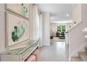 Elegant entryway featuring neutral paint colors and modern decor at 3519 Mcway Falls Ct, Davenport, FL 33837