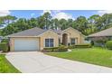 Inviting one-story home with a manicured front lawn, attached garage, and classic curb appeal at 3593 Scoutoak Loop, Oviedo, FL 32765