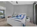 Bright bedroom featuring a ceiling fan, stylish furnishings, and ample natural light at 752 Howland Ln # 114, Altamonte Springs, FL 32701
