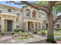 Inviting townhome exteriors with covered entrances and manicured landscaping at 7715 Anselmo Ln, Windermere, FL 34786