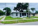 Quaint corner-lot home, featuring a covered carport and screened-in porch at 820 Maley St, Daytona Beach, FL 32114