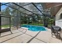 Relax by the crystal-clear pool inside a screened enclosure, surrounded by a spacious patio and a well-fenced backyard at 898 Shed St, Oviedo, FL 32765