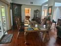 Elegant dining room perfect for gatherings with hardwood floors and ample seating at 116 Oakmont Ln, New Smyrna Beach, FL 32168