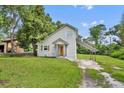 Charming home with an orange front door, neutral siding, and a covered carport at 1161 Dot Dr, Altamonte Springs, FL 32714