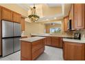 Spacious kitchen with stainless steel appliances and a center island at 14 Camino Real Blvd # 14, Howey In The Hills, FL 34737