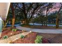 Beautiful landscaping with lush gardens and lighting at 140 Sweet Bay Cir, Lake Mary, FL 32746